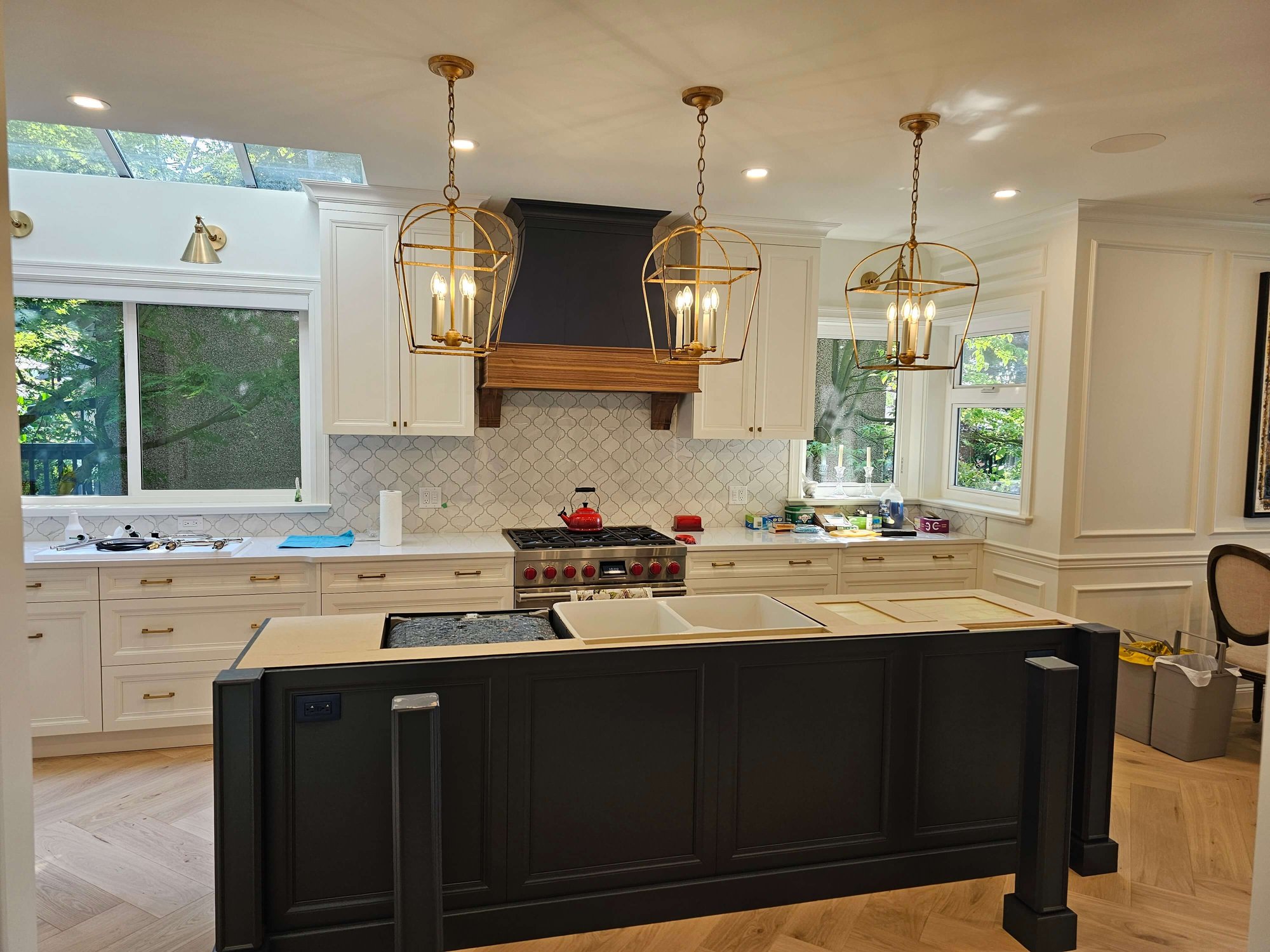 electrician work done for customer's kitchen with bird cage light fixtures over kitchen island