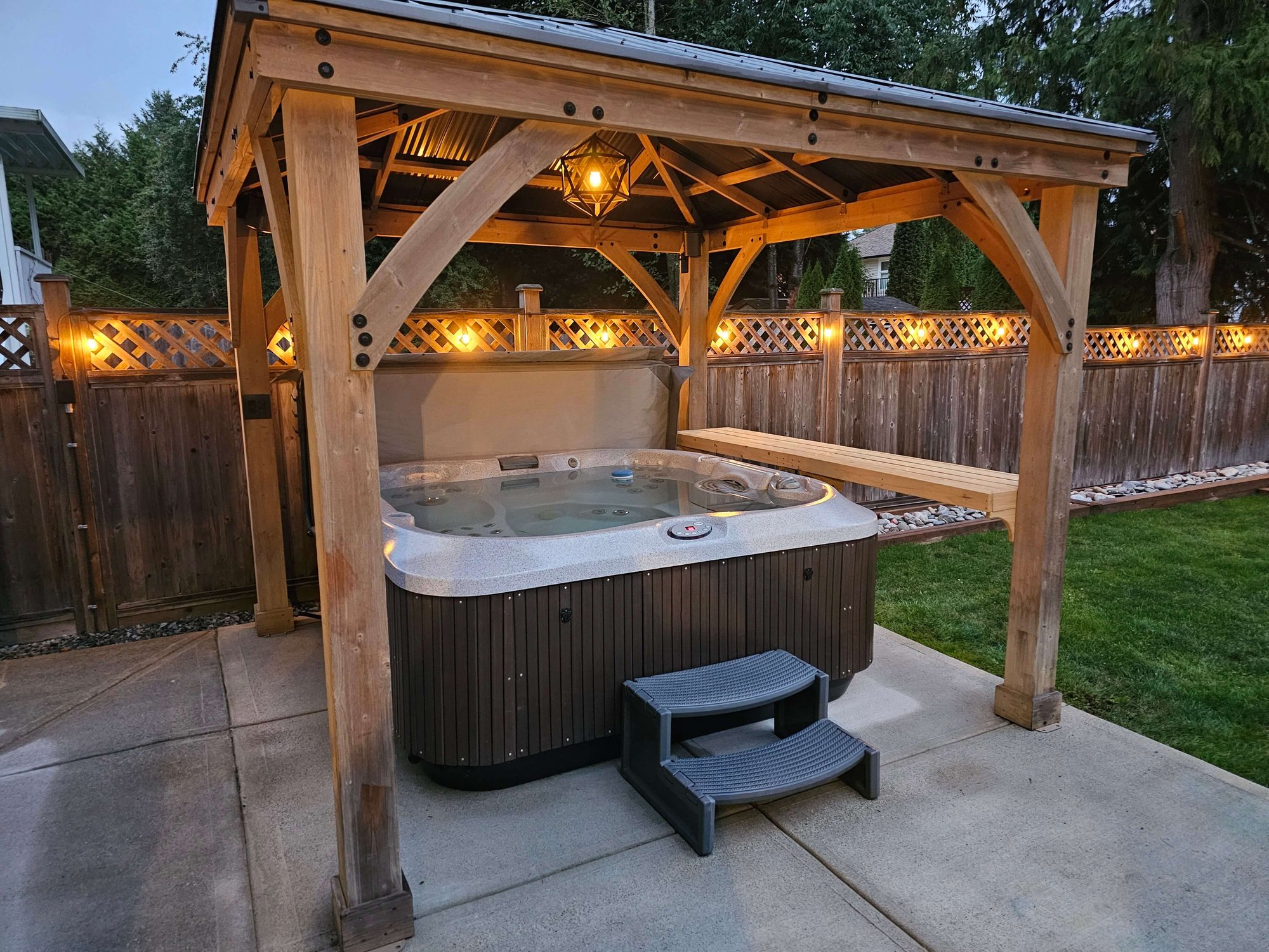 electrician work done for hot tub lights on fencing and in wooden gazebo